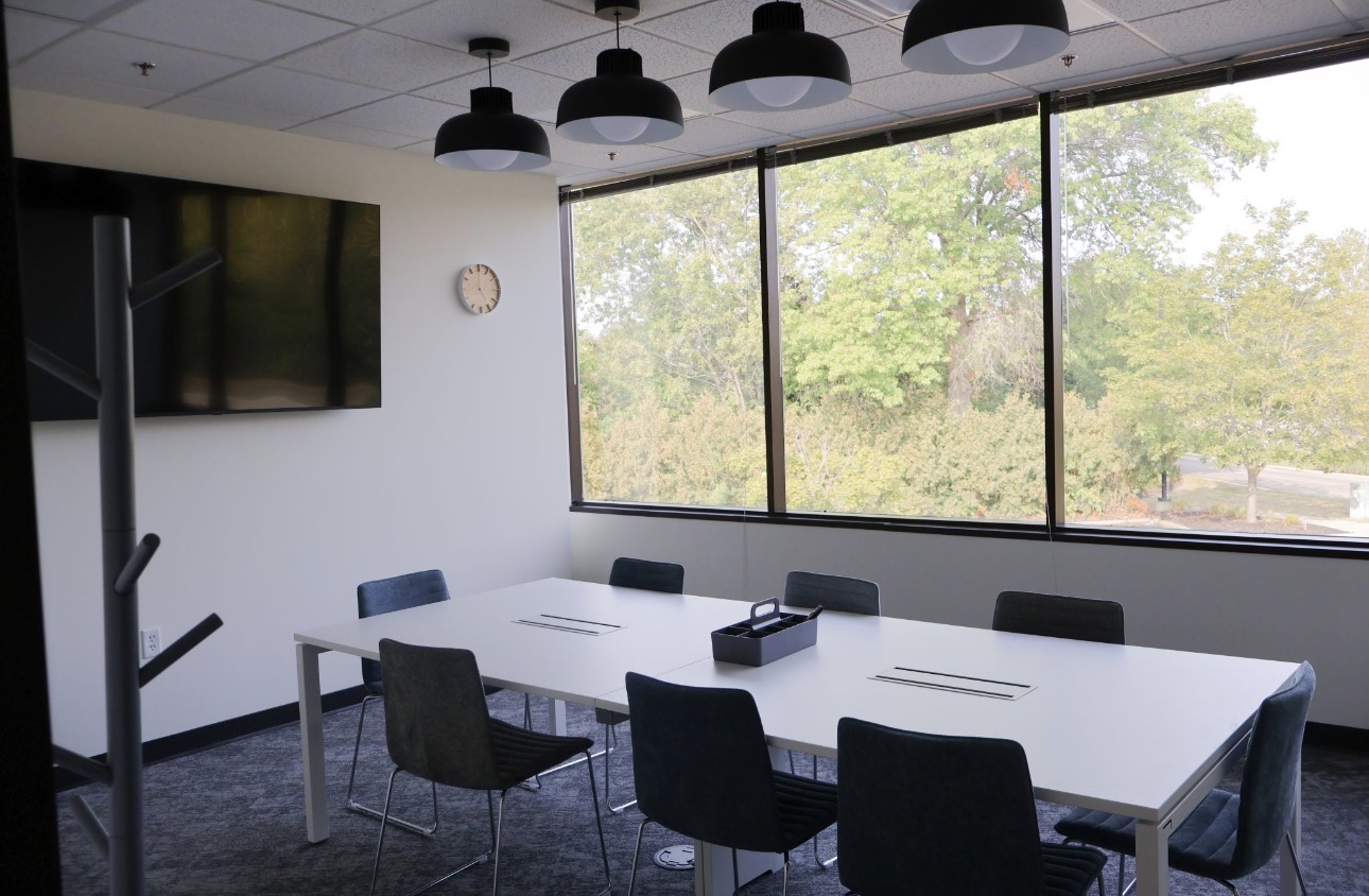 Conference room with repainted walls and window wall
