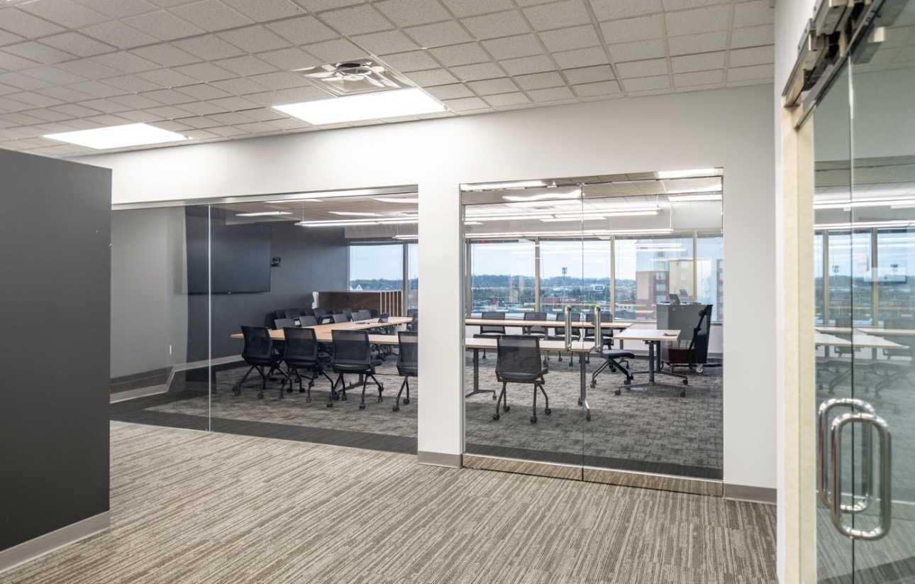 Glass-front training and conference rooms off the open floor