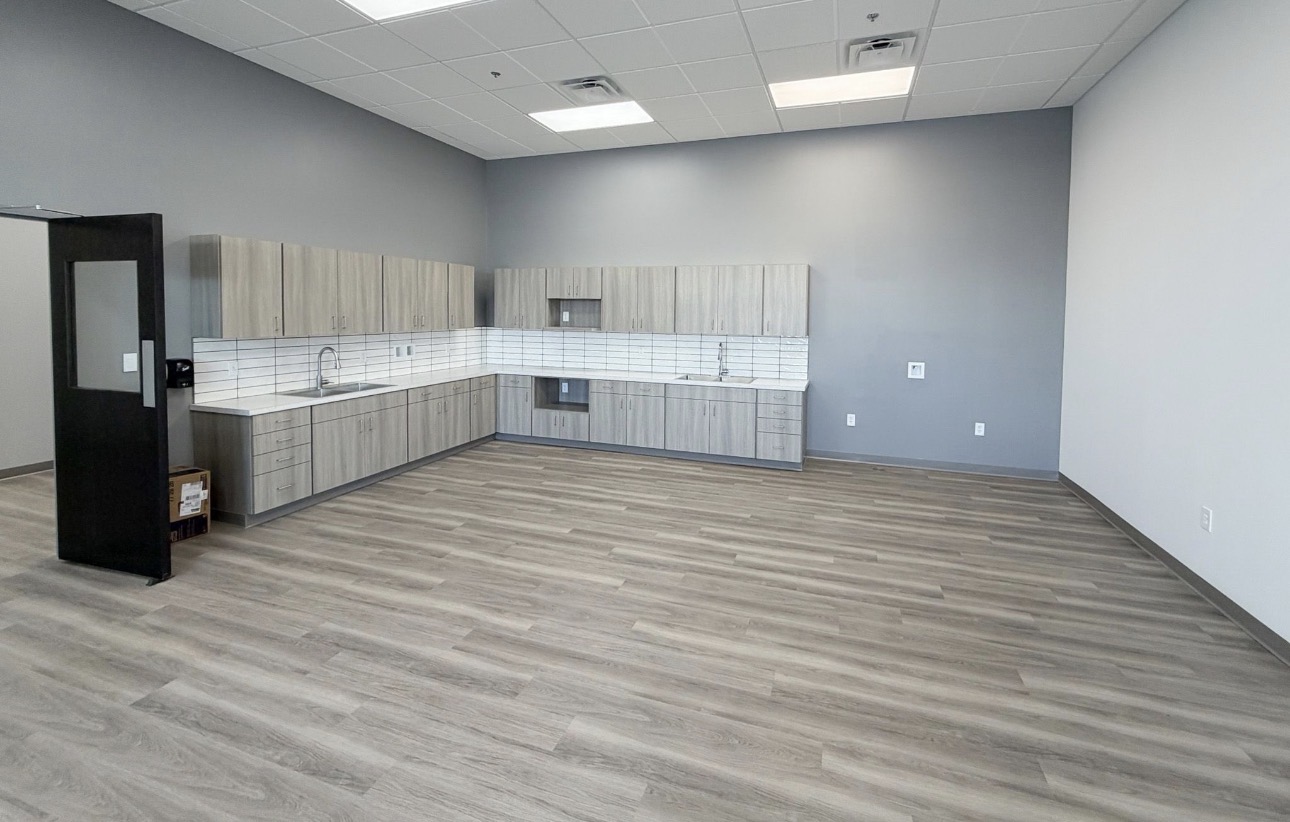 Break room with two-tone accent wall and casework