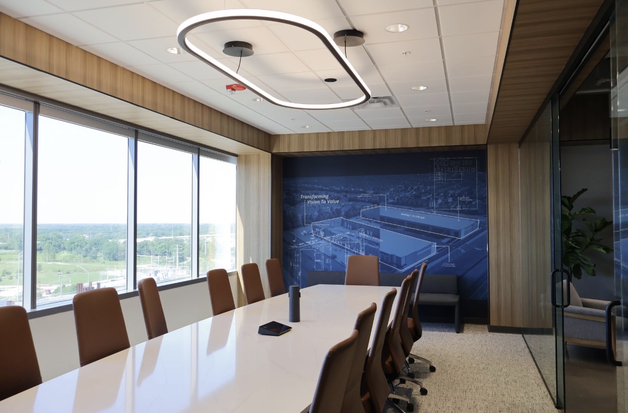 Boardroom with vinyl wallcovering feature wall and wood-panel returns