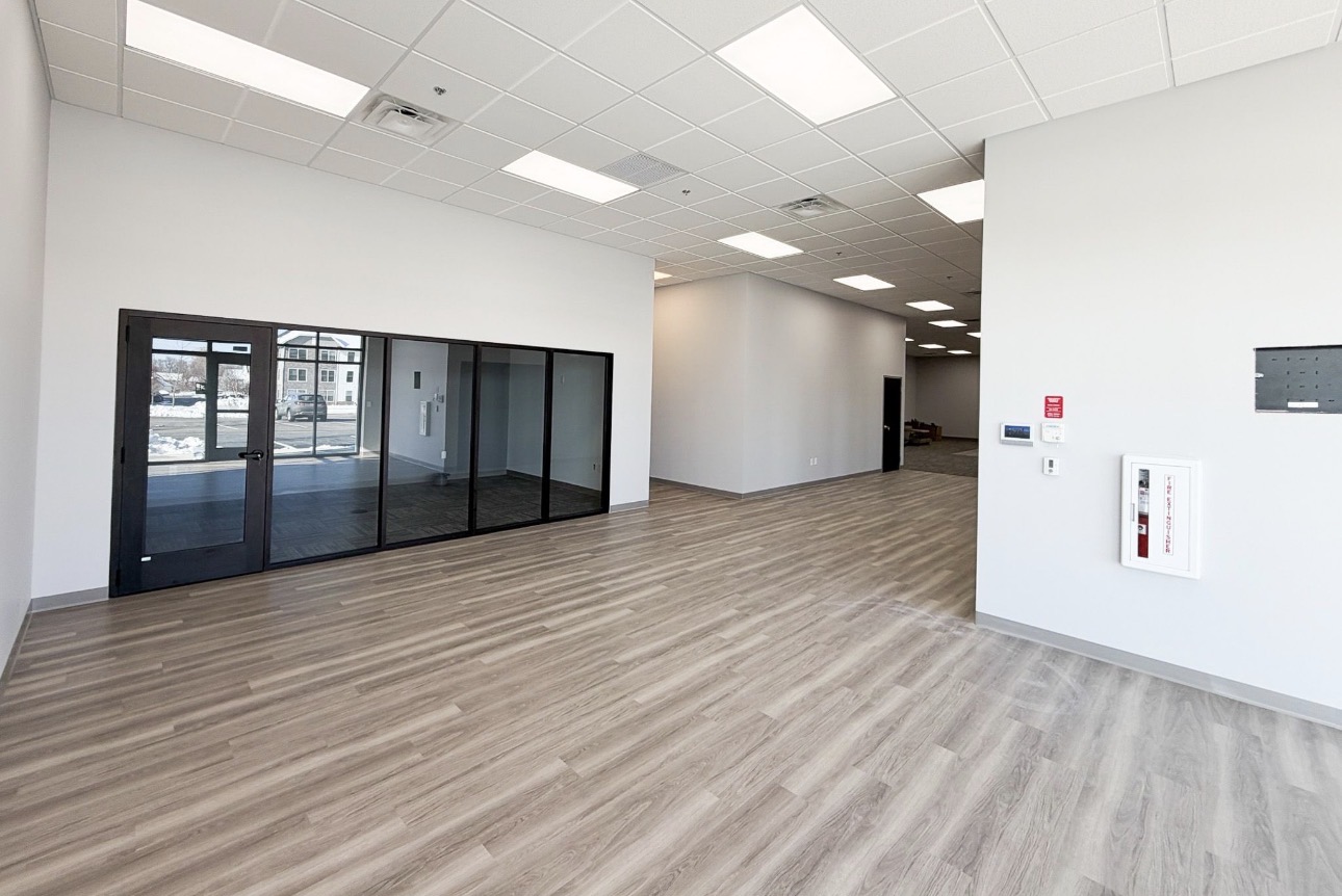 Office lobby with storefront glazing and finished walls