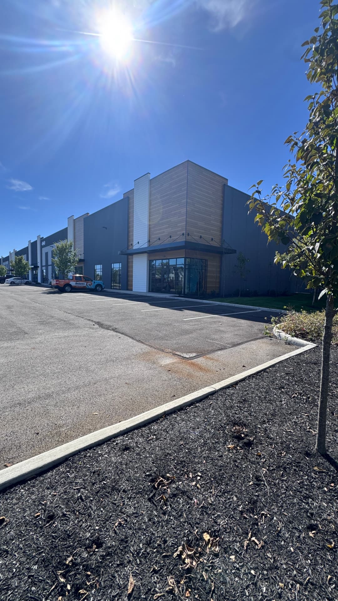 Class A warehouse park — two-facility exterior repaint